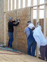 Workers building wall